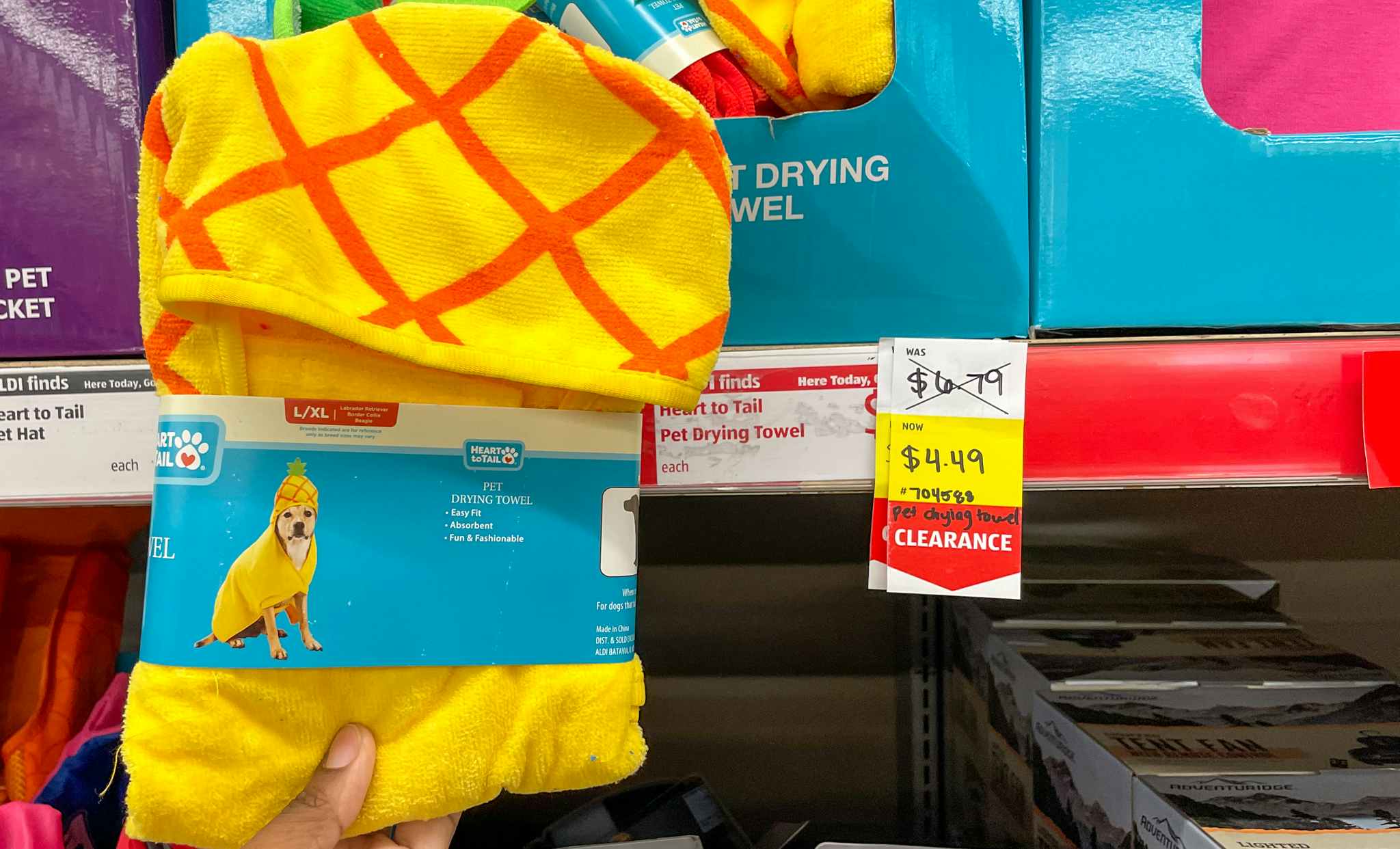 pet towel held up near sales sign at aldi