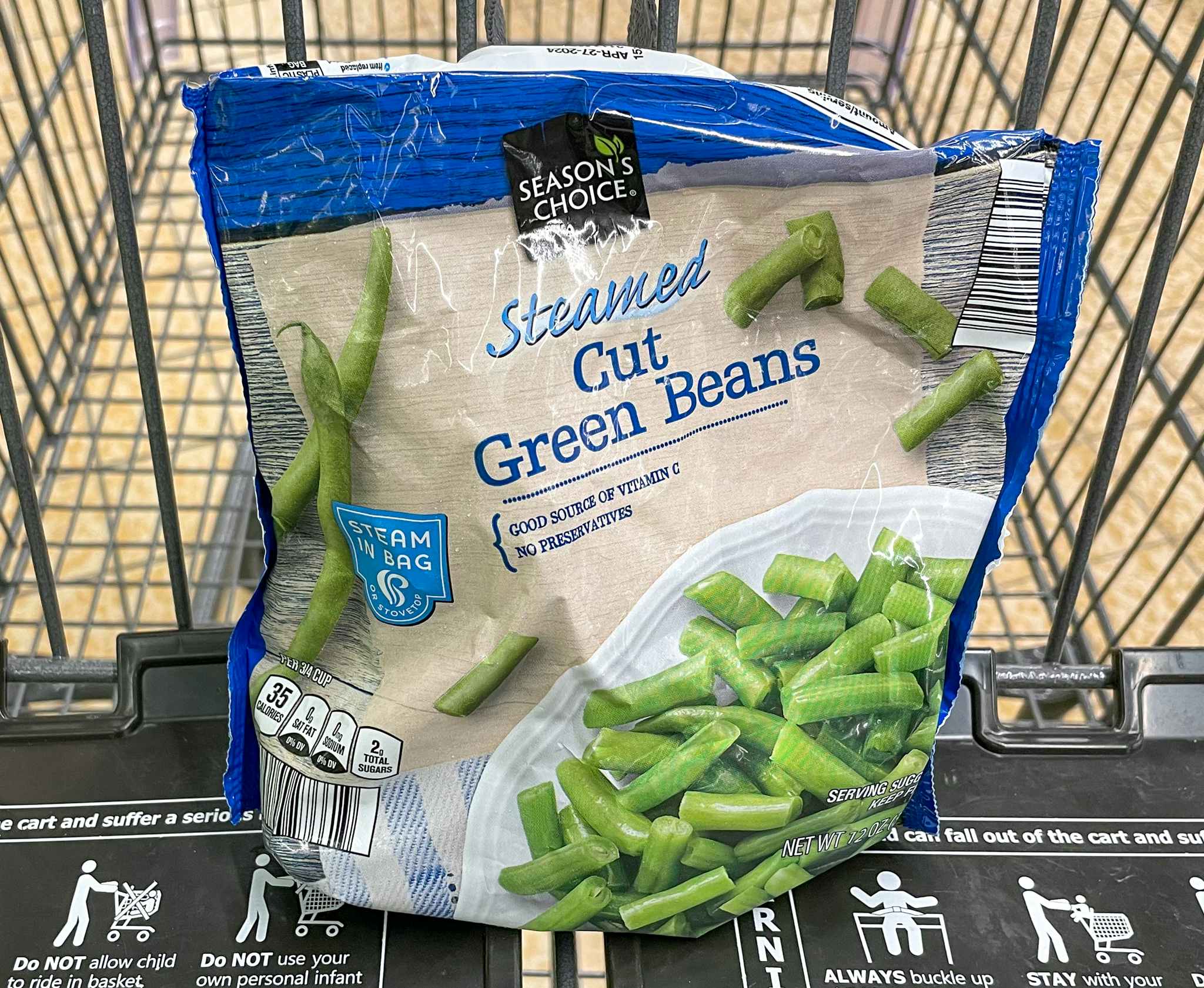 frozen green beans in package in a cart at aldi