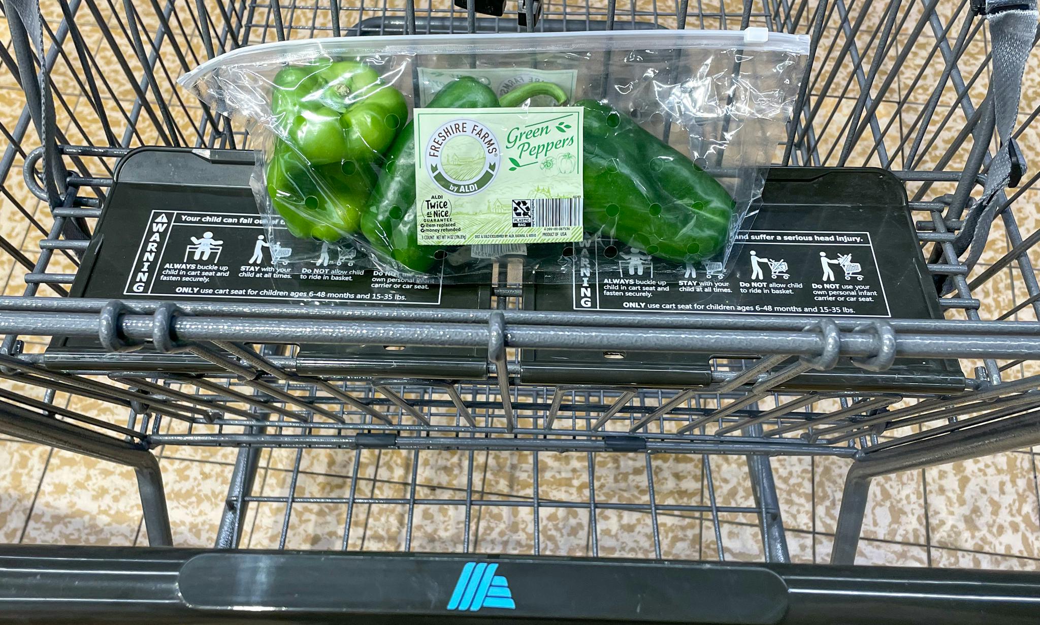 green peppers packaged in a cart at aldi