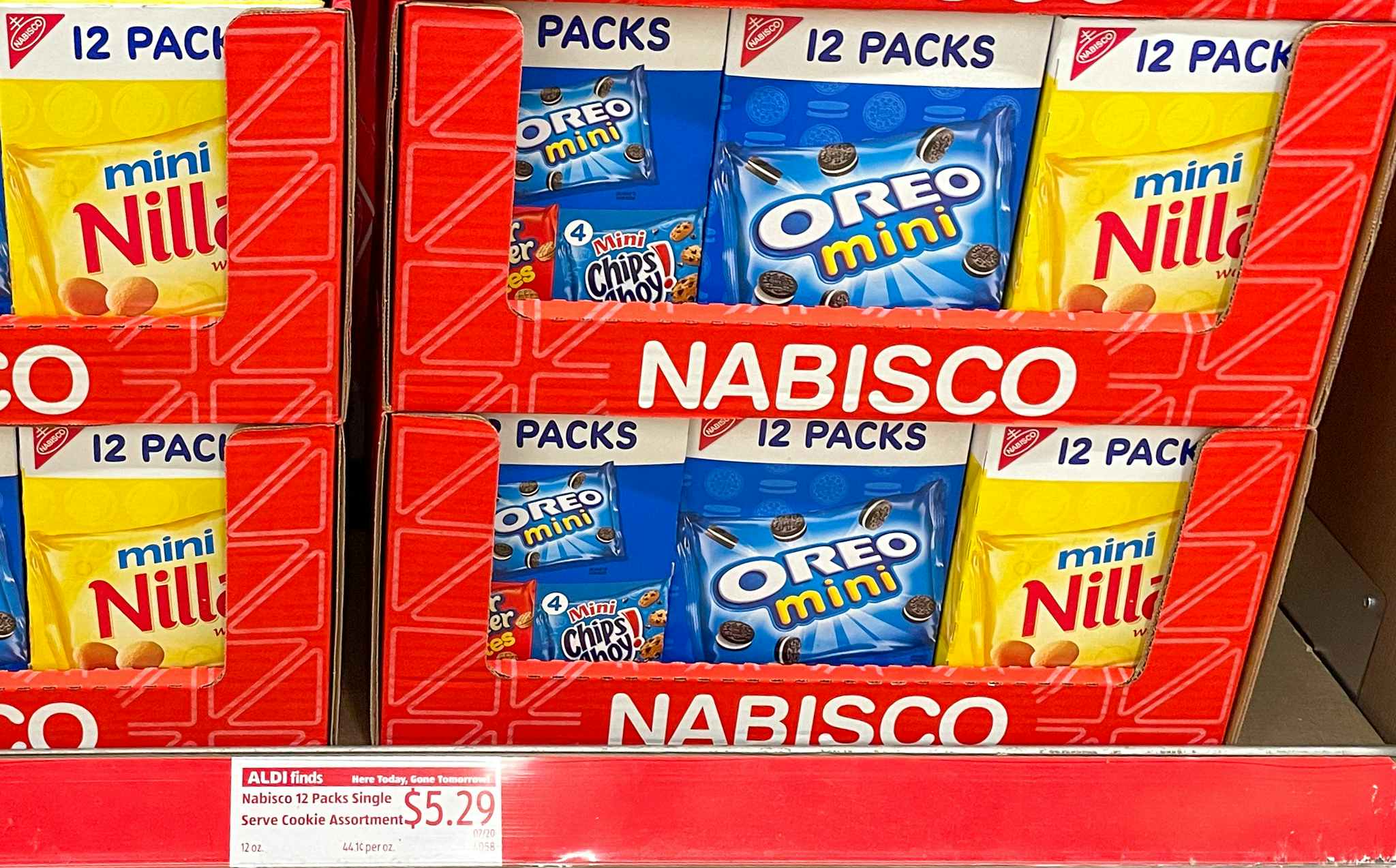 nabisco 12 pack variety snacks on a shelf at aldi with price tag