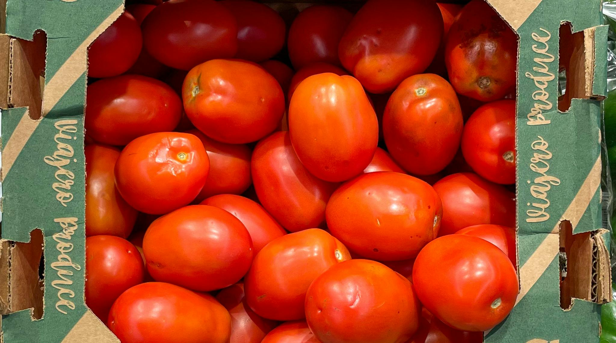 Roma tomatoes in a box at aldi
