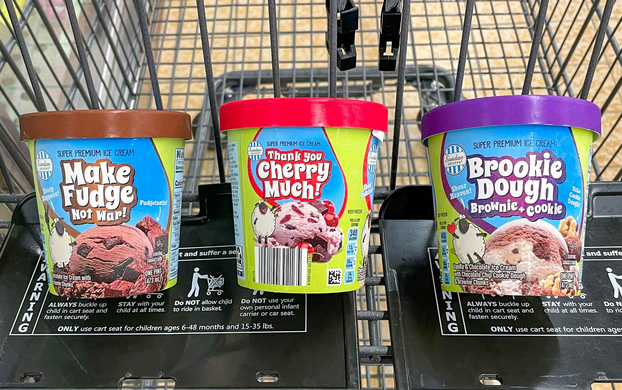 three flavors of premium ice cream in a cart at aldi 