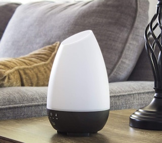 An essential oil diffuser on a table.