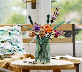 A bouquet of LEGO flowers in a vase on a table