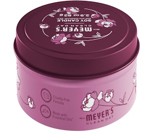 Pink and purple candle tin on a white background