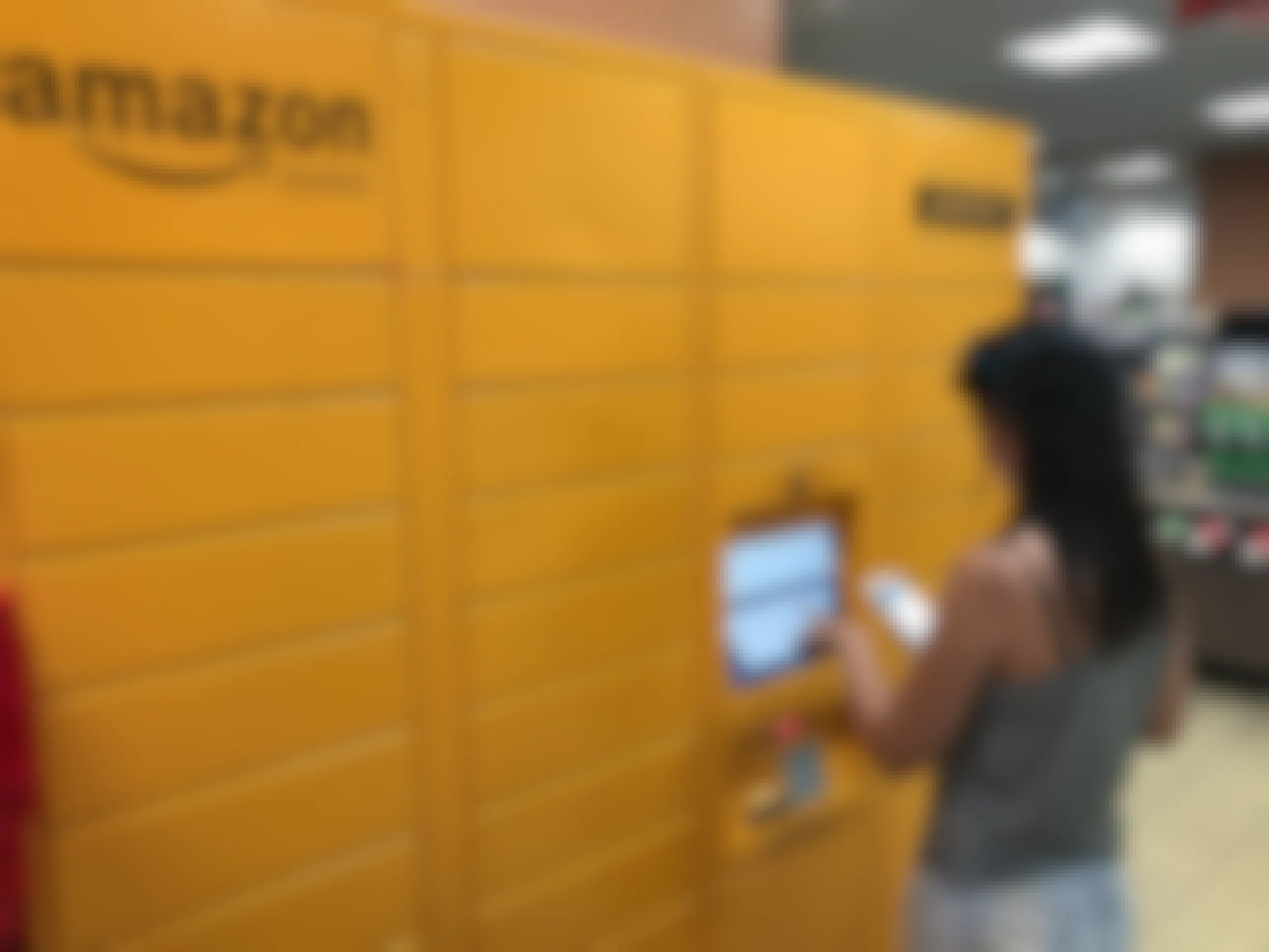 a woman typing in her code at an amazon locker hub
