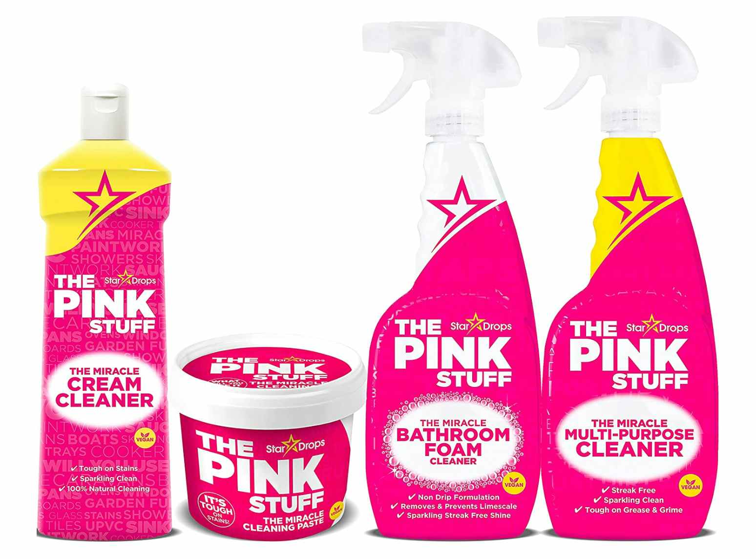 Four pink cleaning containers and bottles on a whitebackground