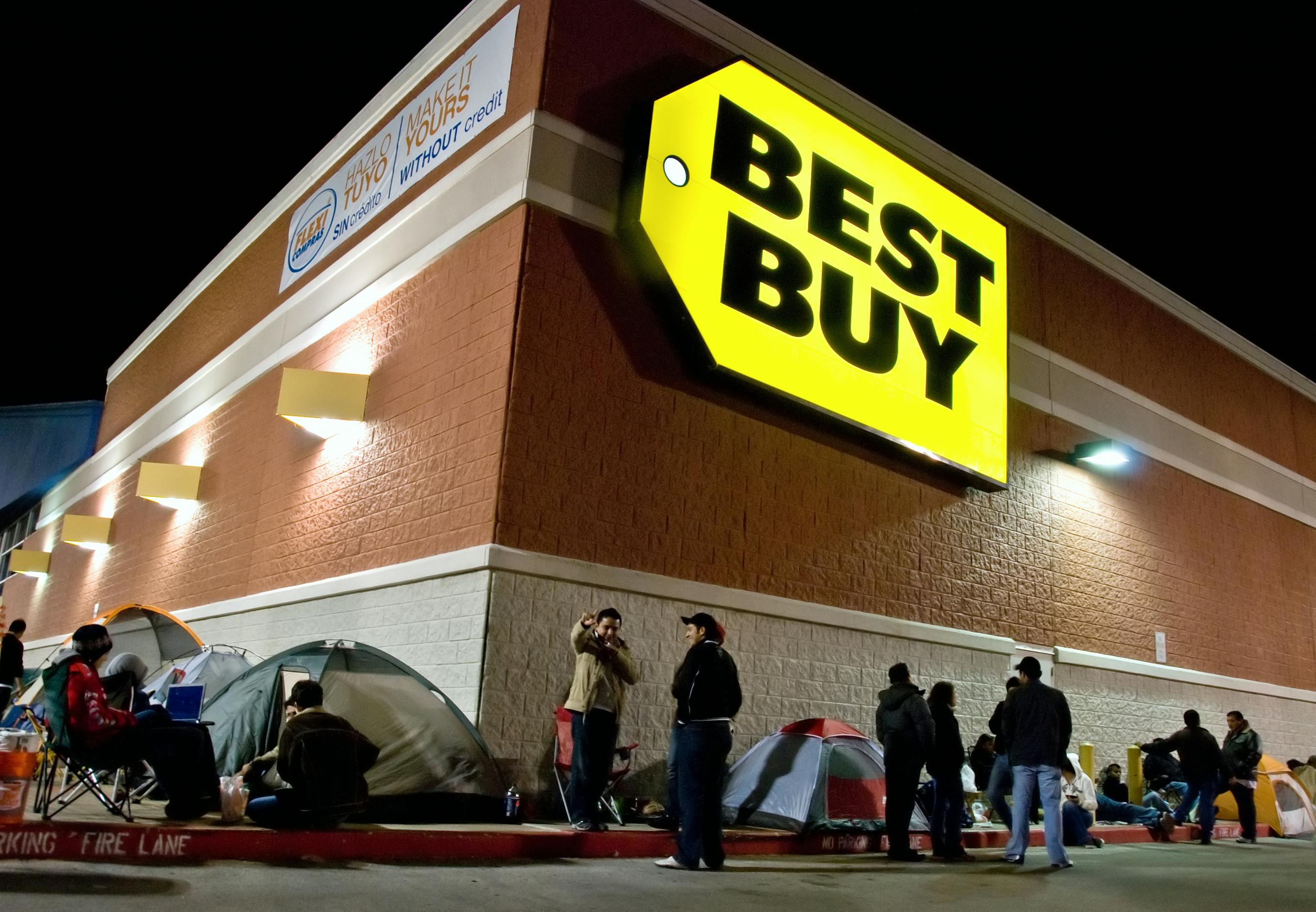people camping out in tents outside the Best Buy store for Black Friday