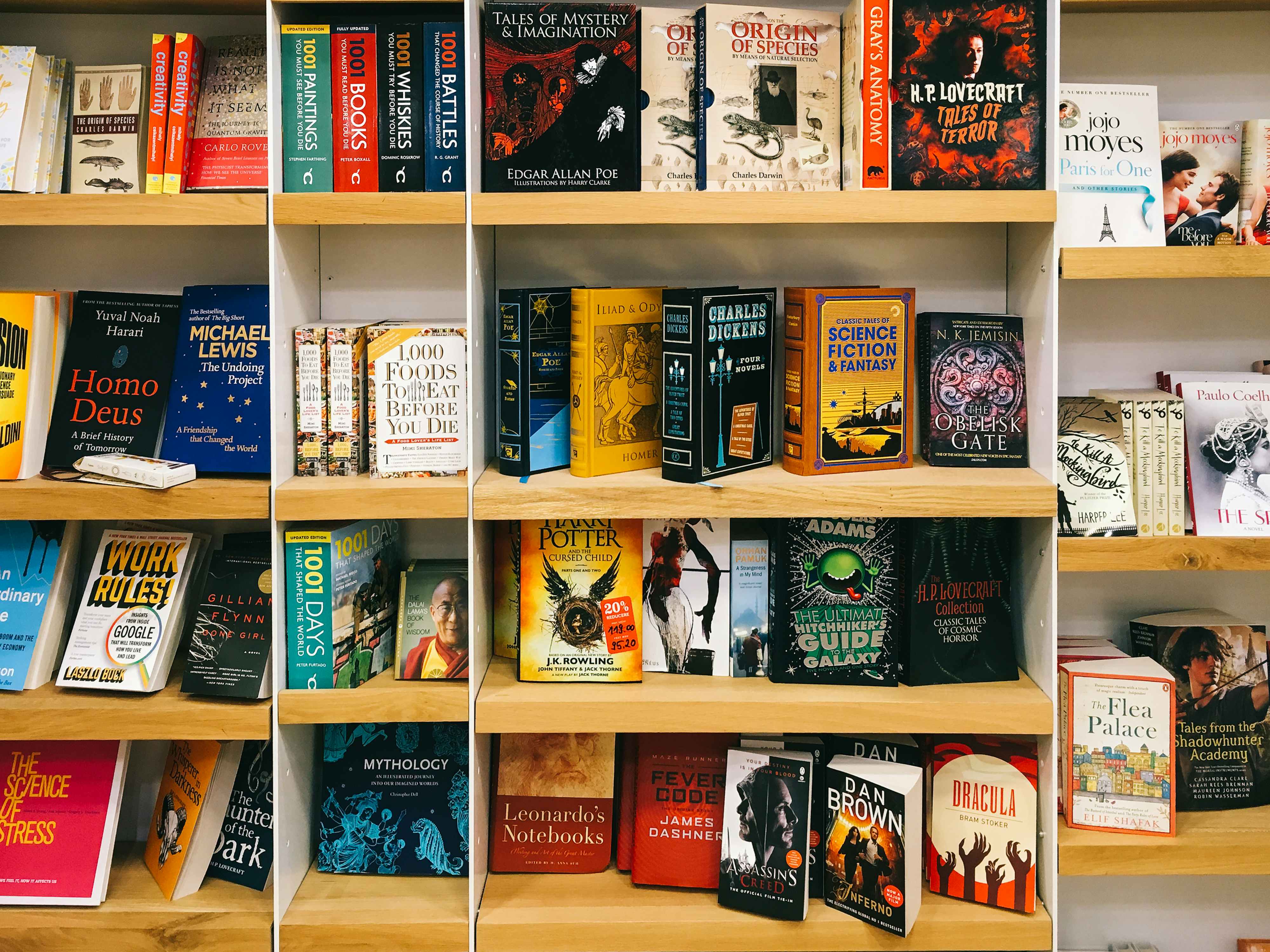 A wall of bookshelves filled with science fiction books.