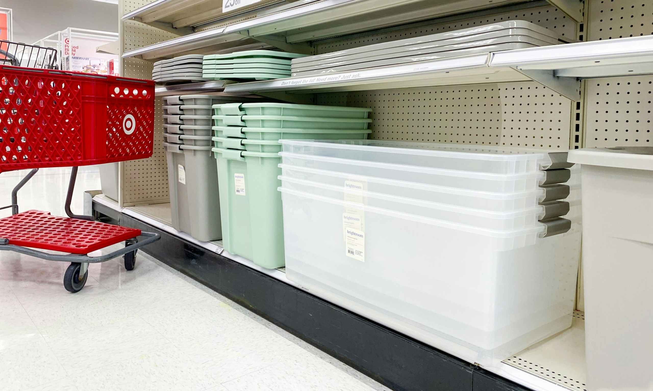 a shelf at target containing assorted brightroom storage bins with a sale sign