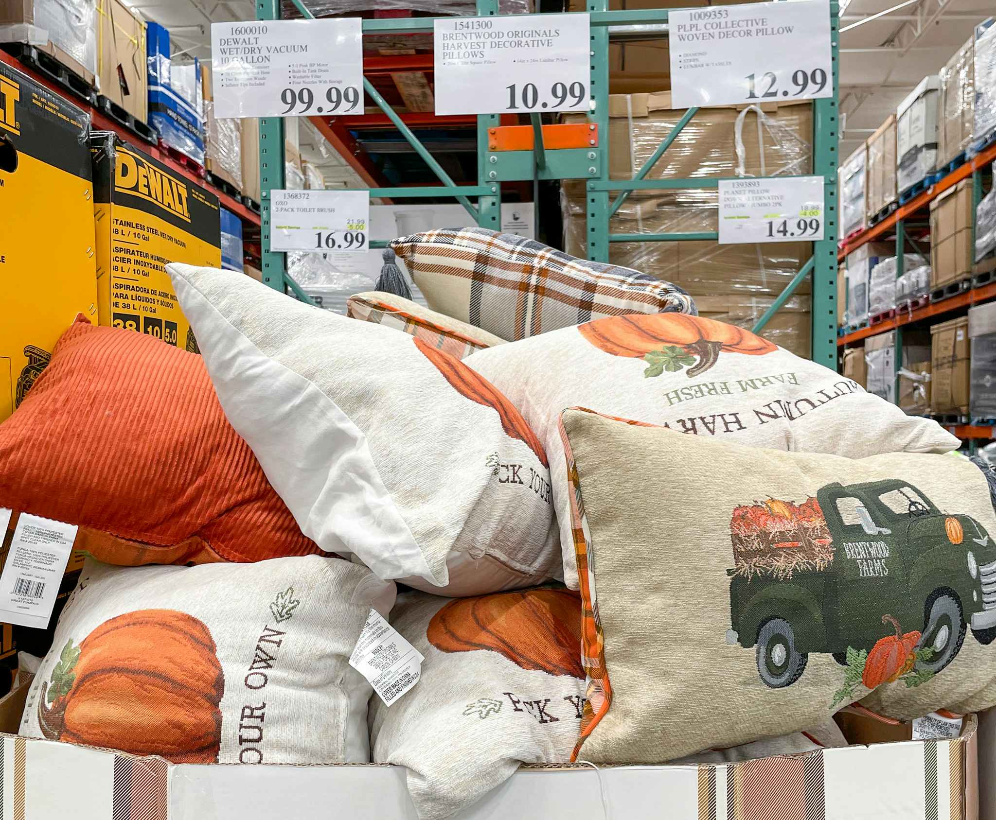 harvest decorative pillows in a box with sales tag at costco 