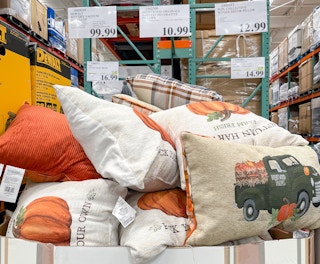 harvest decorative pillows in a box with sales tag at costco