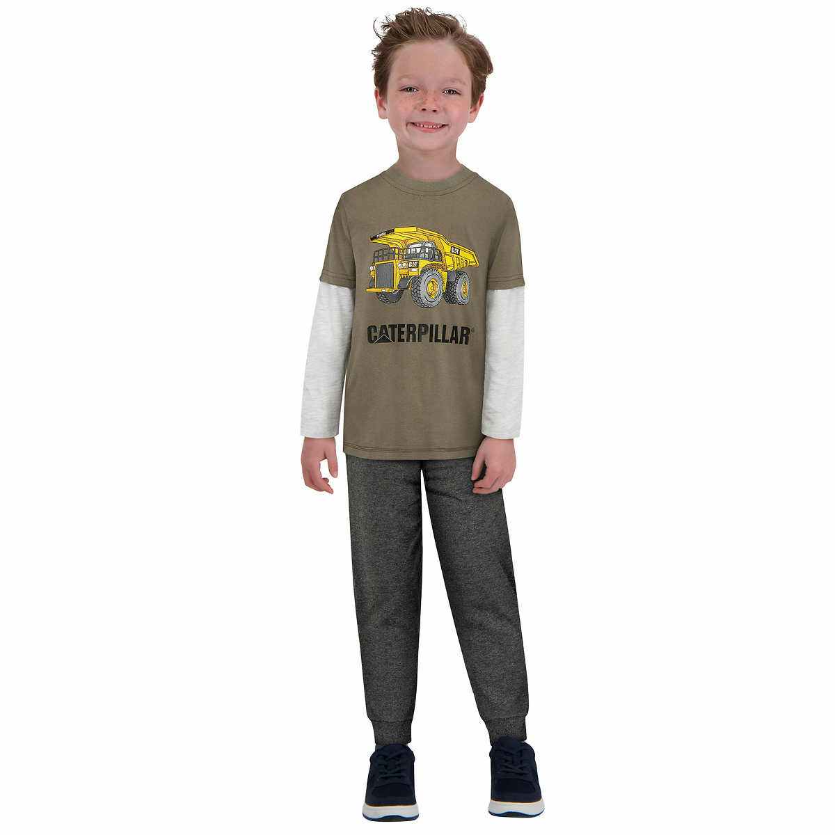a boy wearing a caterpillar clothing set