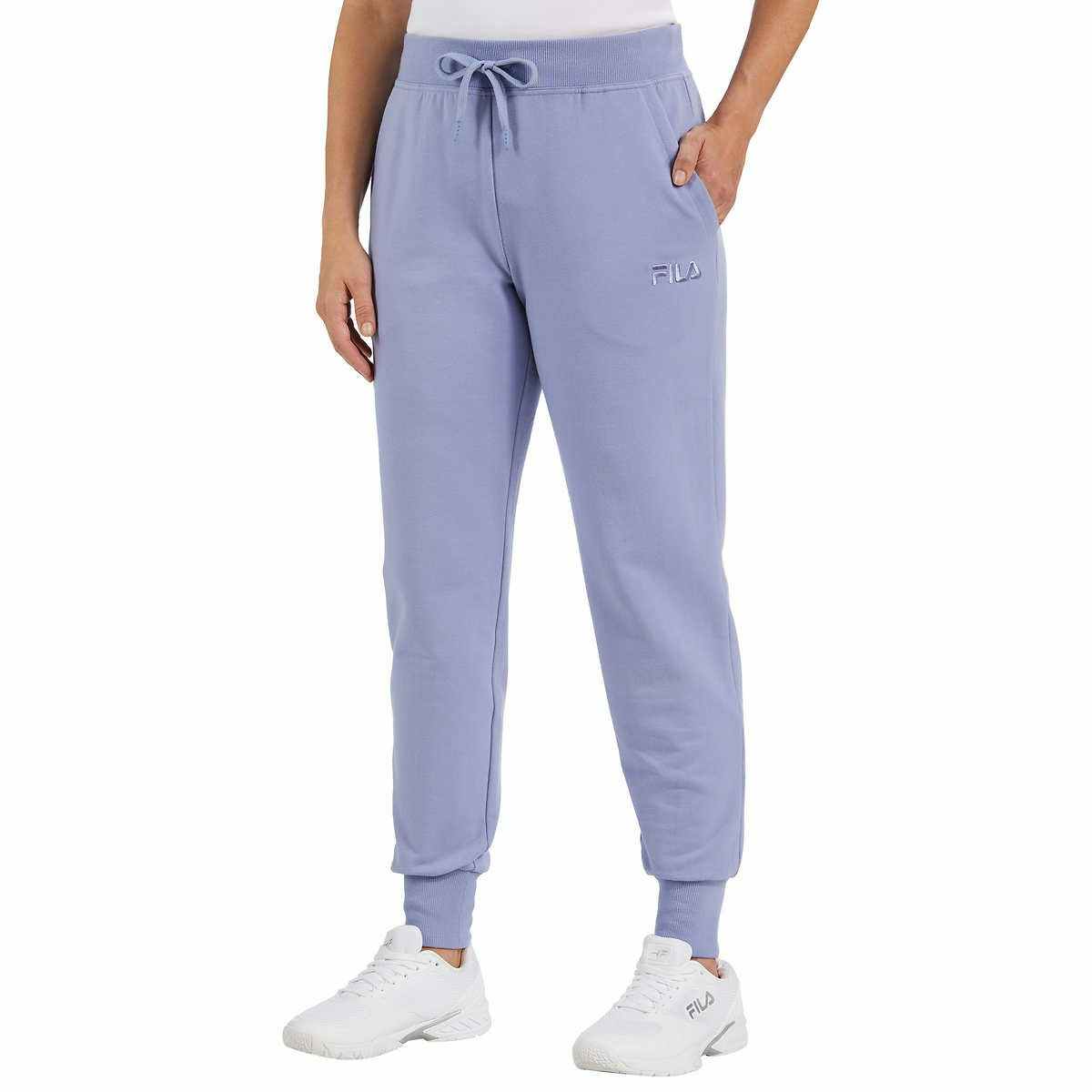 model wearing fila womens jogger with one hand in pocket