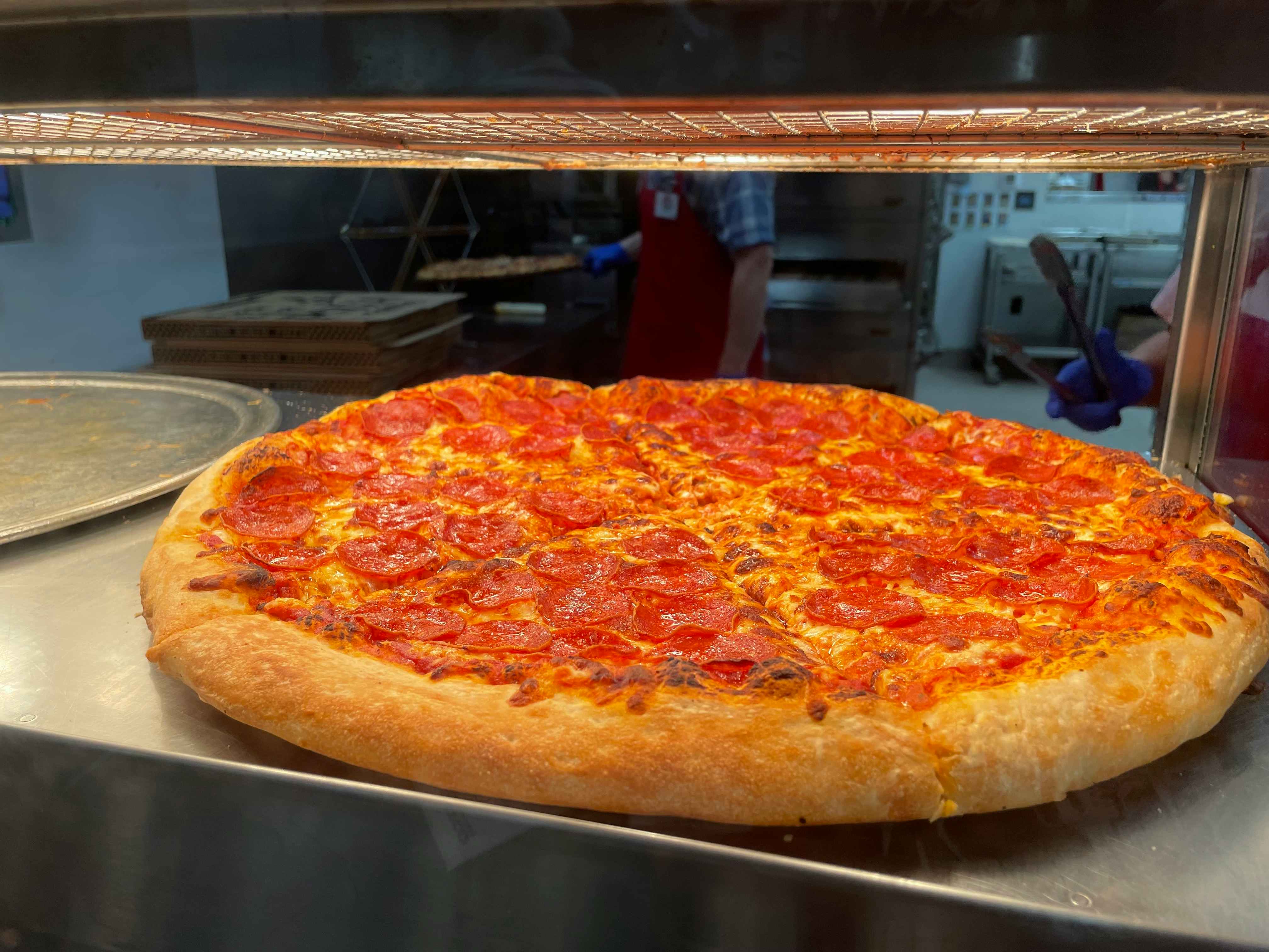 A whole pepperoni pizza on display at the Costco food court
