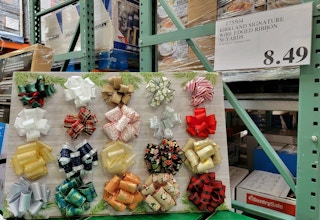 display of several different christmas ribbons at costco next to a sales tag