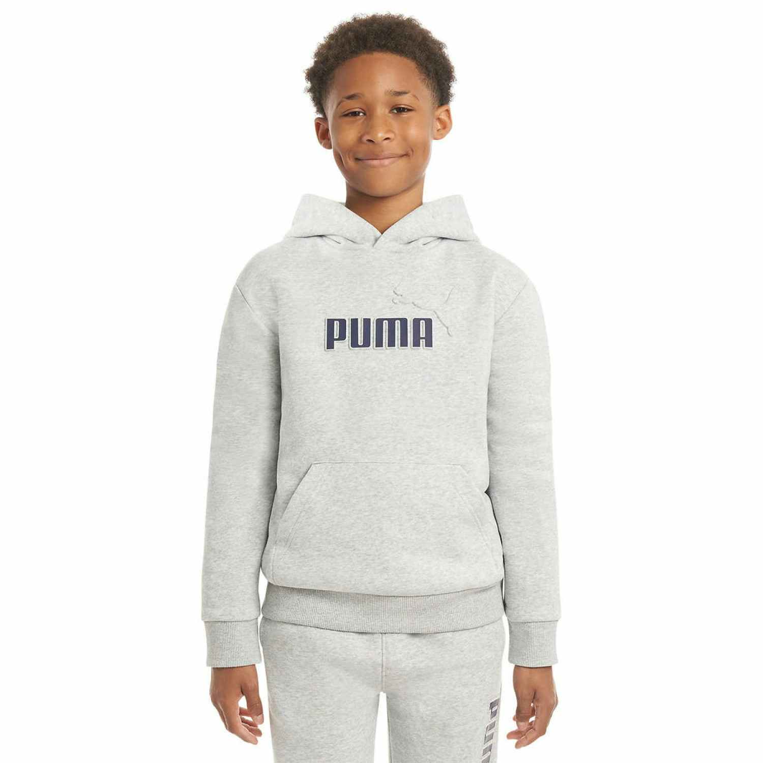 boy wearing a grey puma hoodie