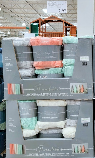 multi-colored towels in a display at costco