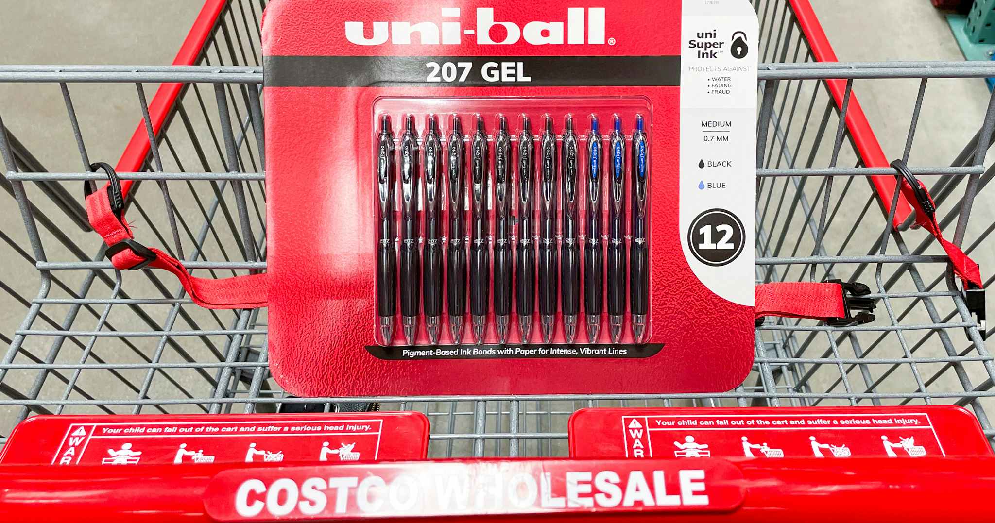 uni-ball pens in a cart at costco