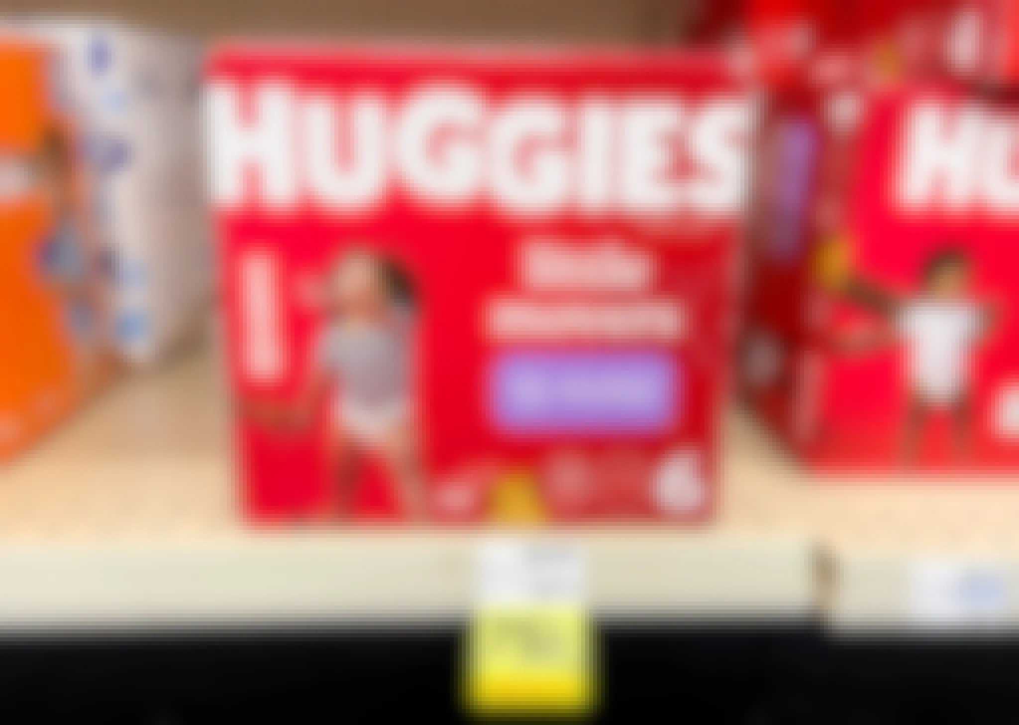 Huggies boxed diapers on shelf with yellow 75% off clearance tag