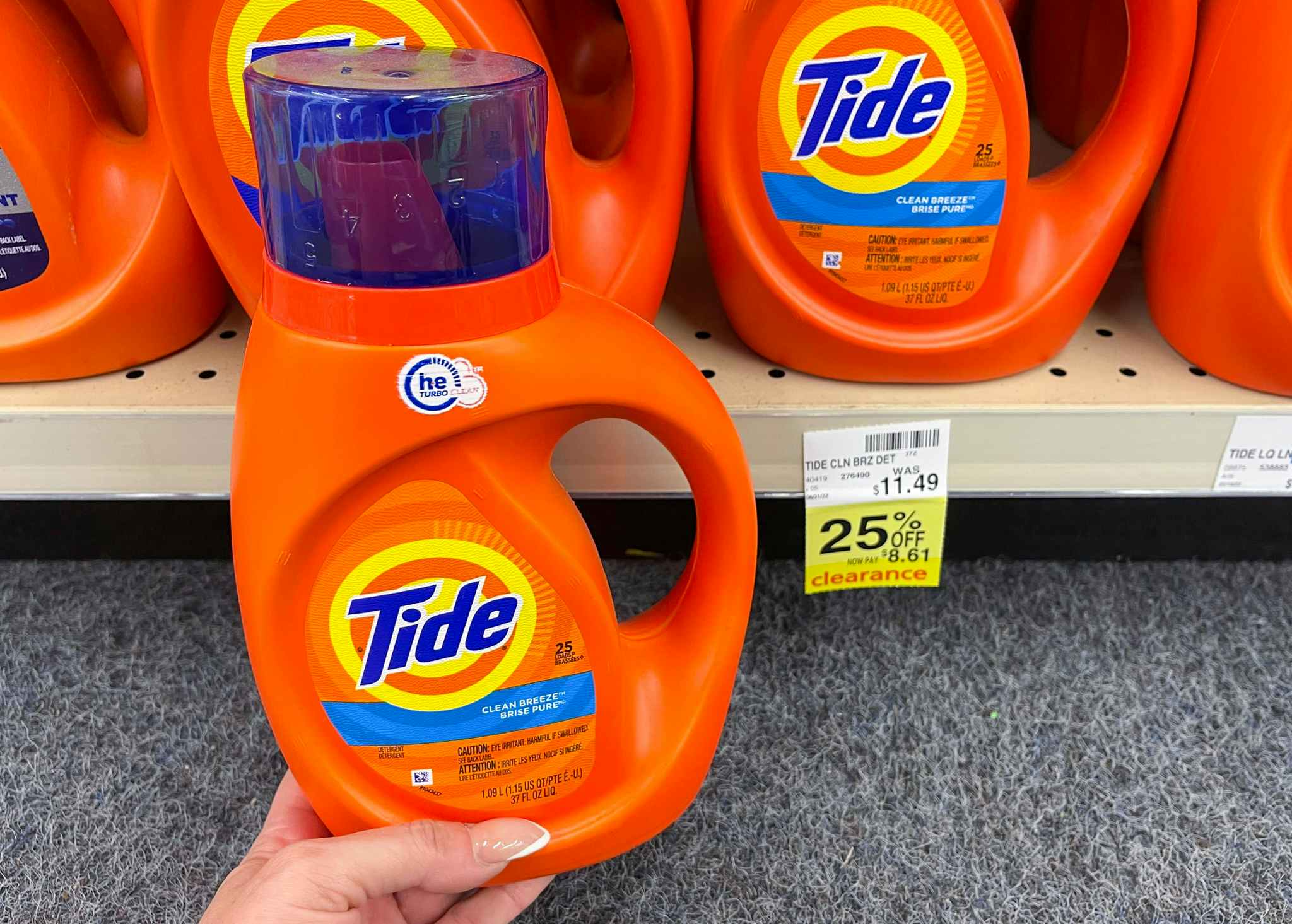 tide laundry detergent held in front of clearance tag