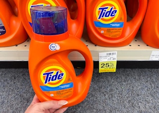 tide laundry detergent held in front of clearance tag