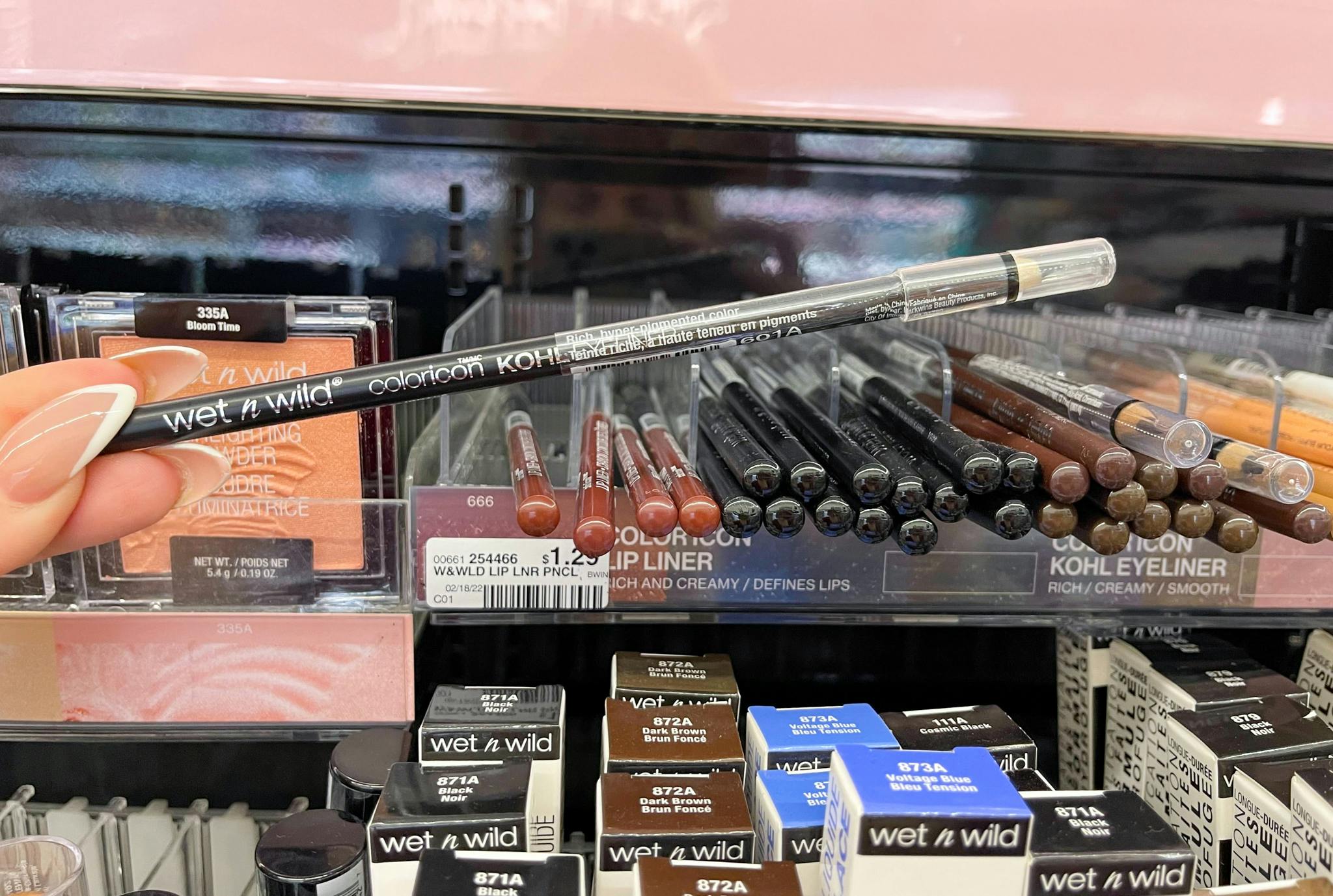 wet n wild eyeliner held next to price tag