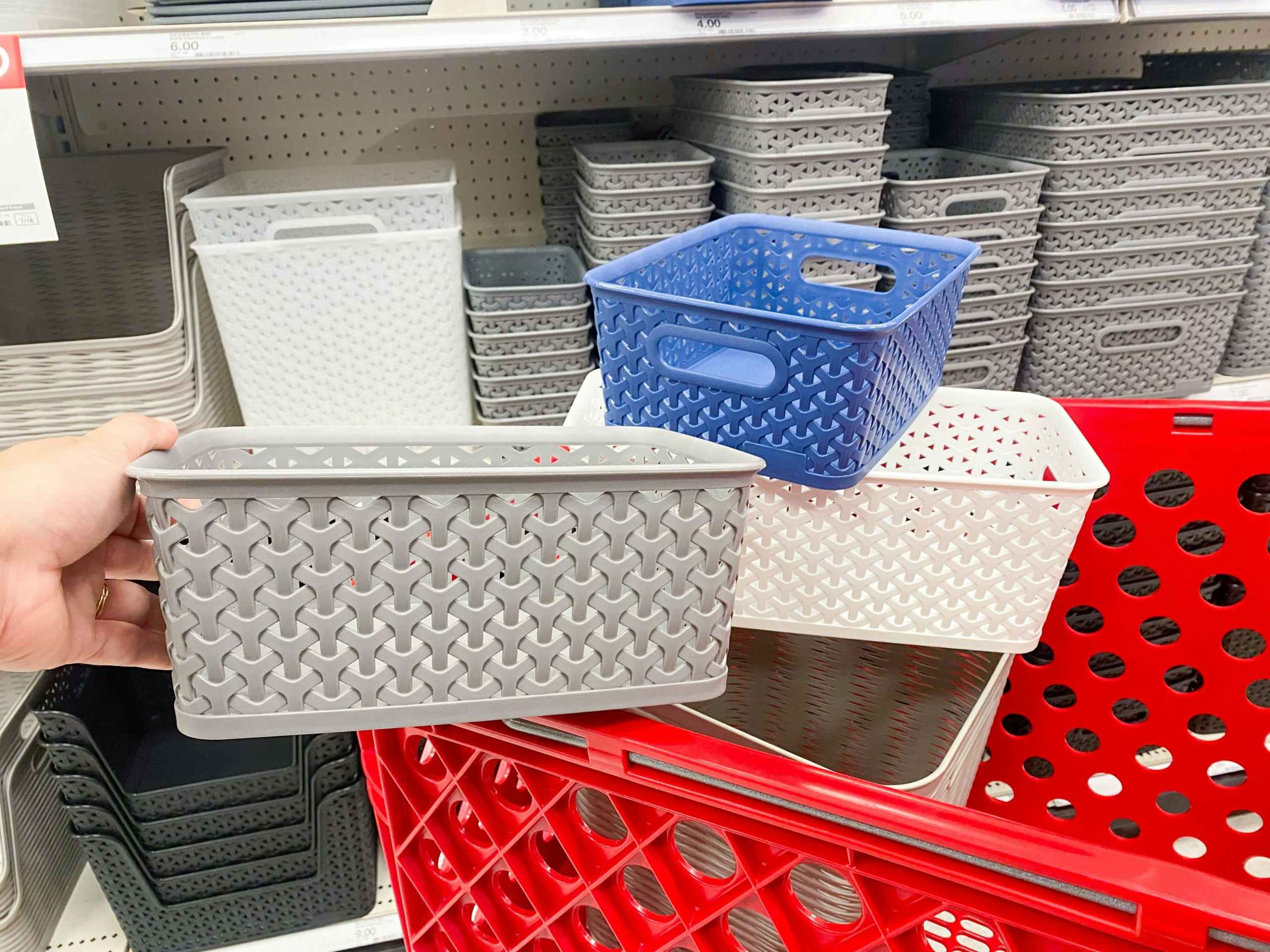 Three small decorative storage baskets in a Target shopping cart