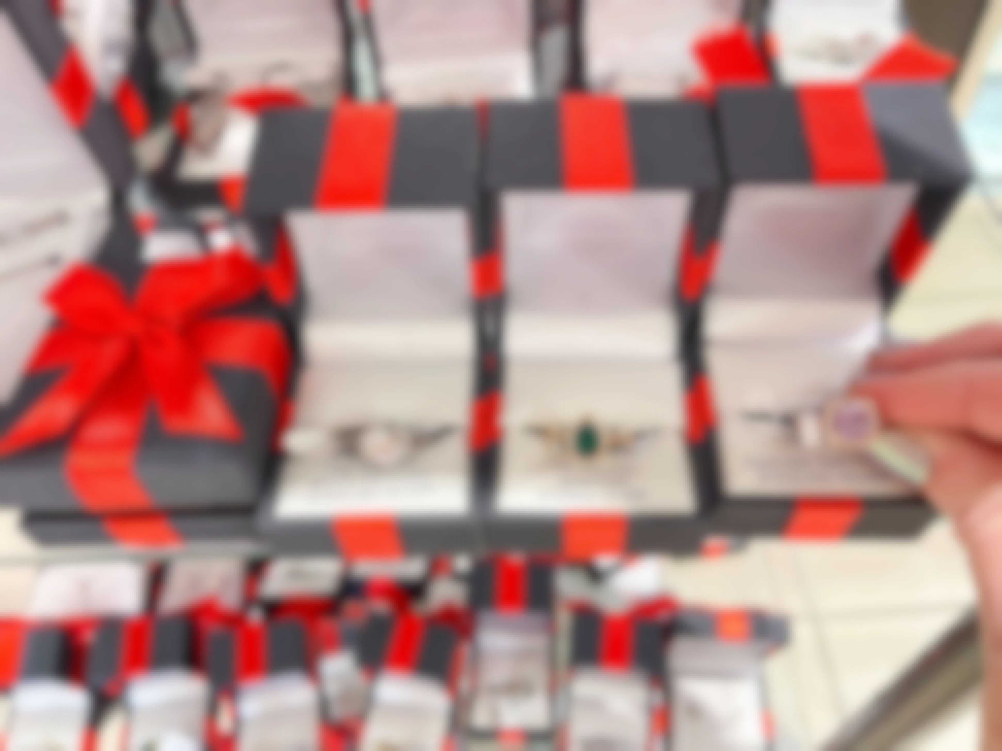display of jewelry in red and black boxes
