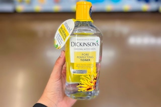 hand holding a bottle of dickinson's witch hazel toner