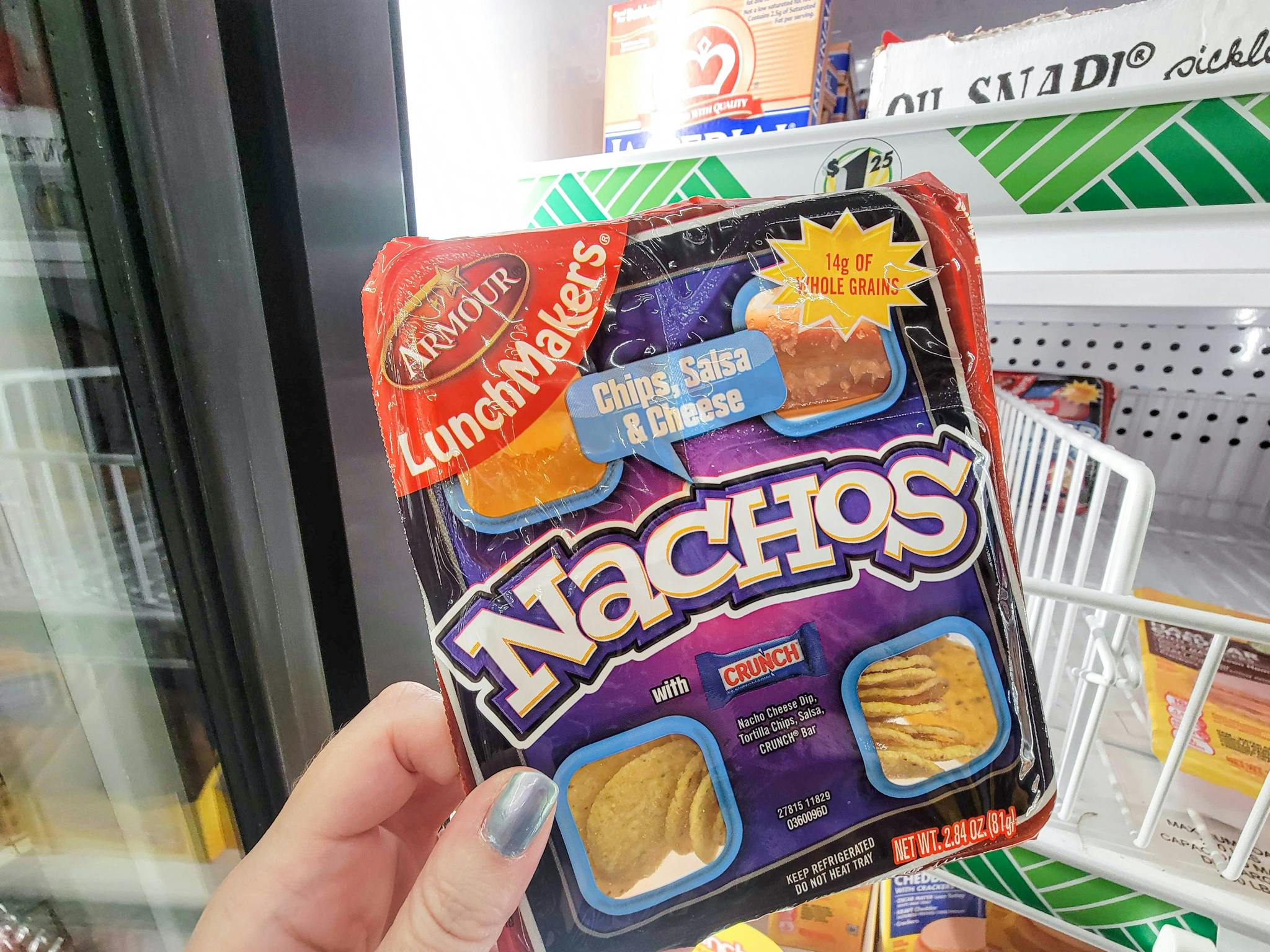 hand holding a pack of nacho lunch makers