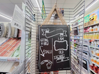 chalkboard sign that you fill in height, age, teeth, age, etc