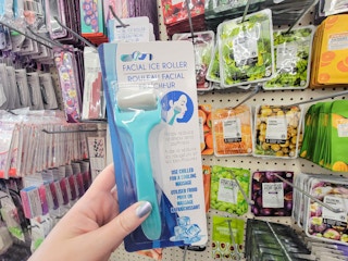 hand holding a facial ice roller