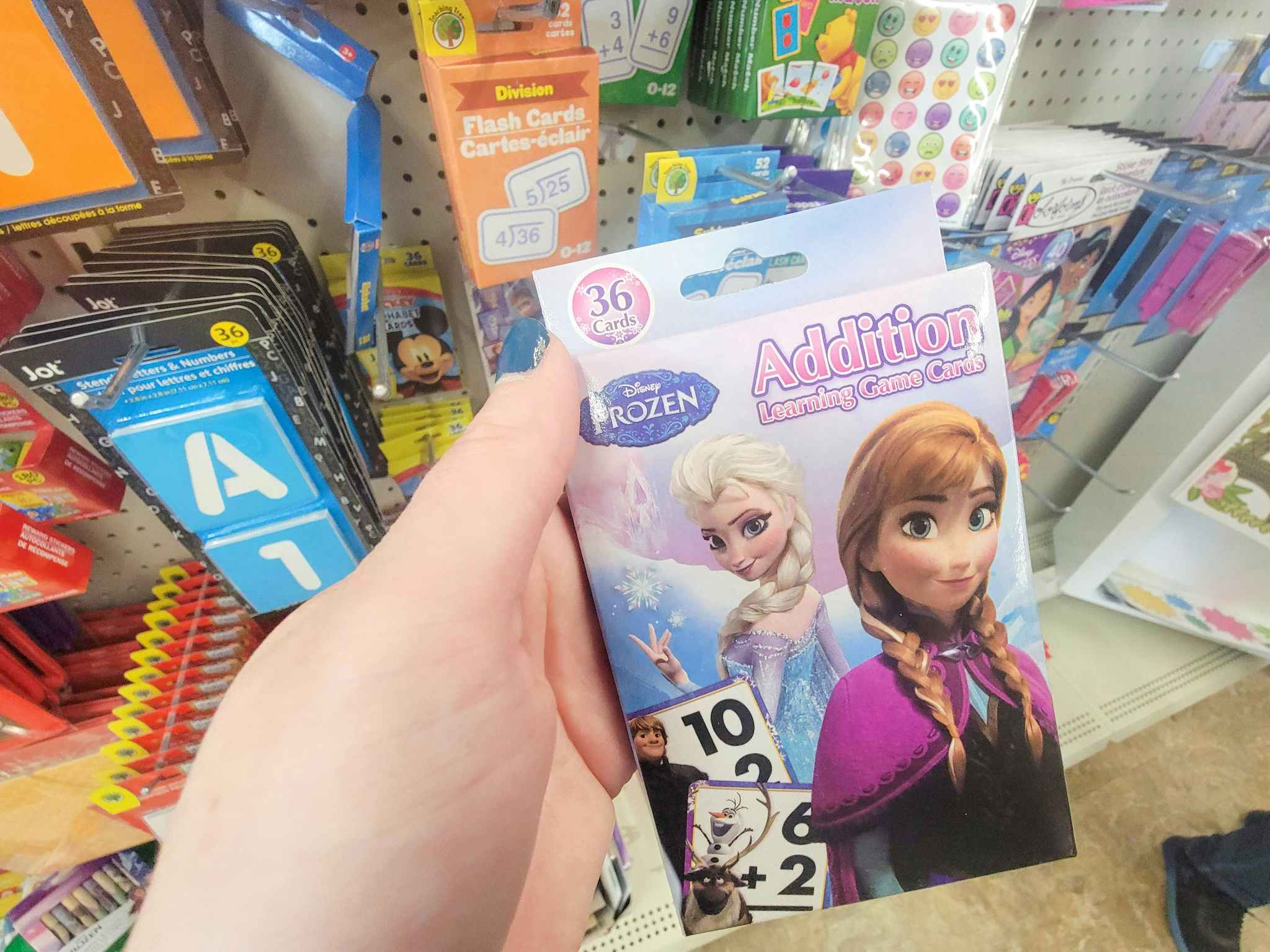 hand holding disney frozen addition flash cards