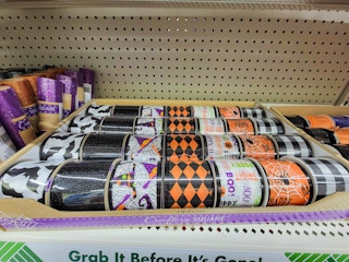 rolls of halloween themed crafting ribbon