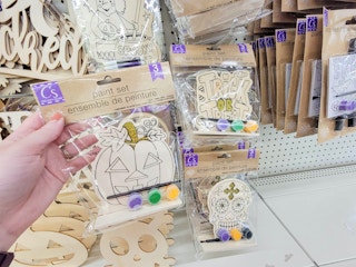 hand holding a halloween themed painting set