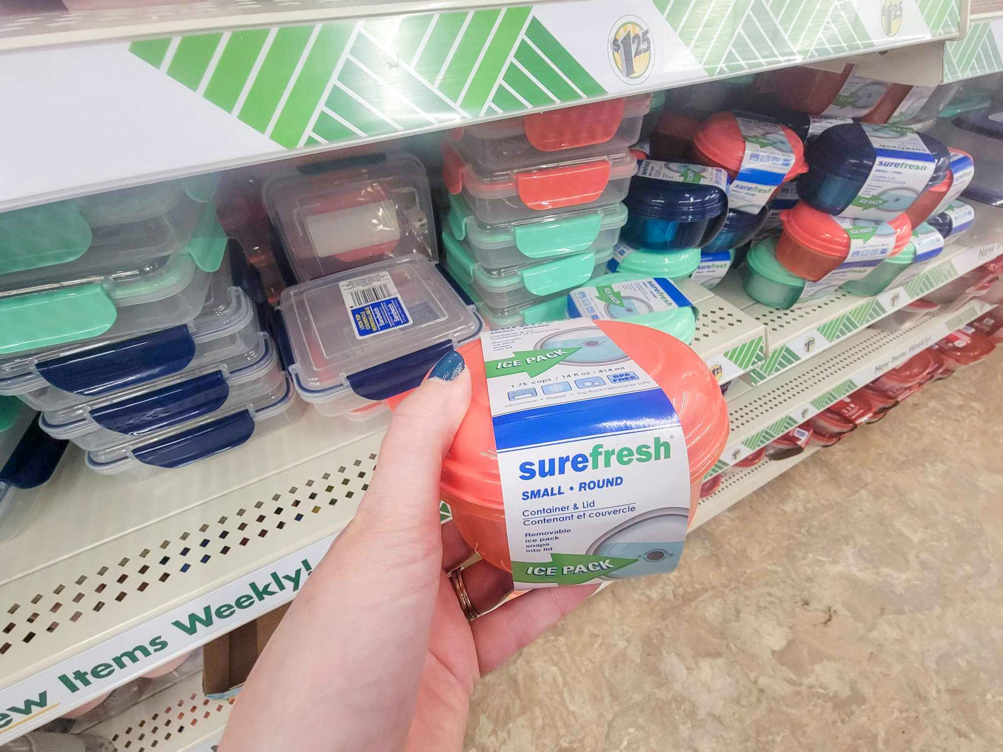 hand holding a small lunch container