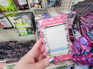 hand holding a facial polishing cloth