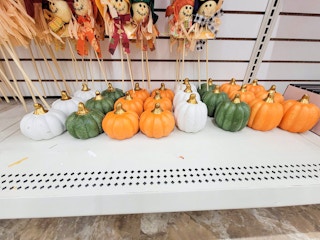 white, green, and orange decorative pumpkins