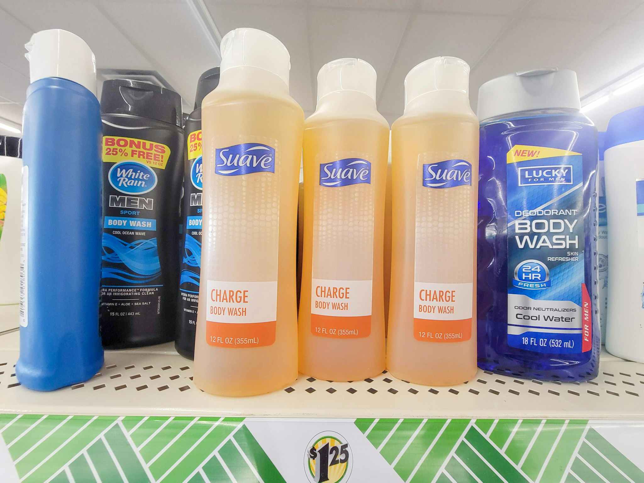 3 bottles of orange suave body wash on a shelf
