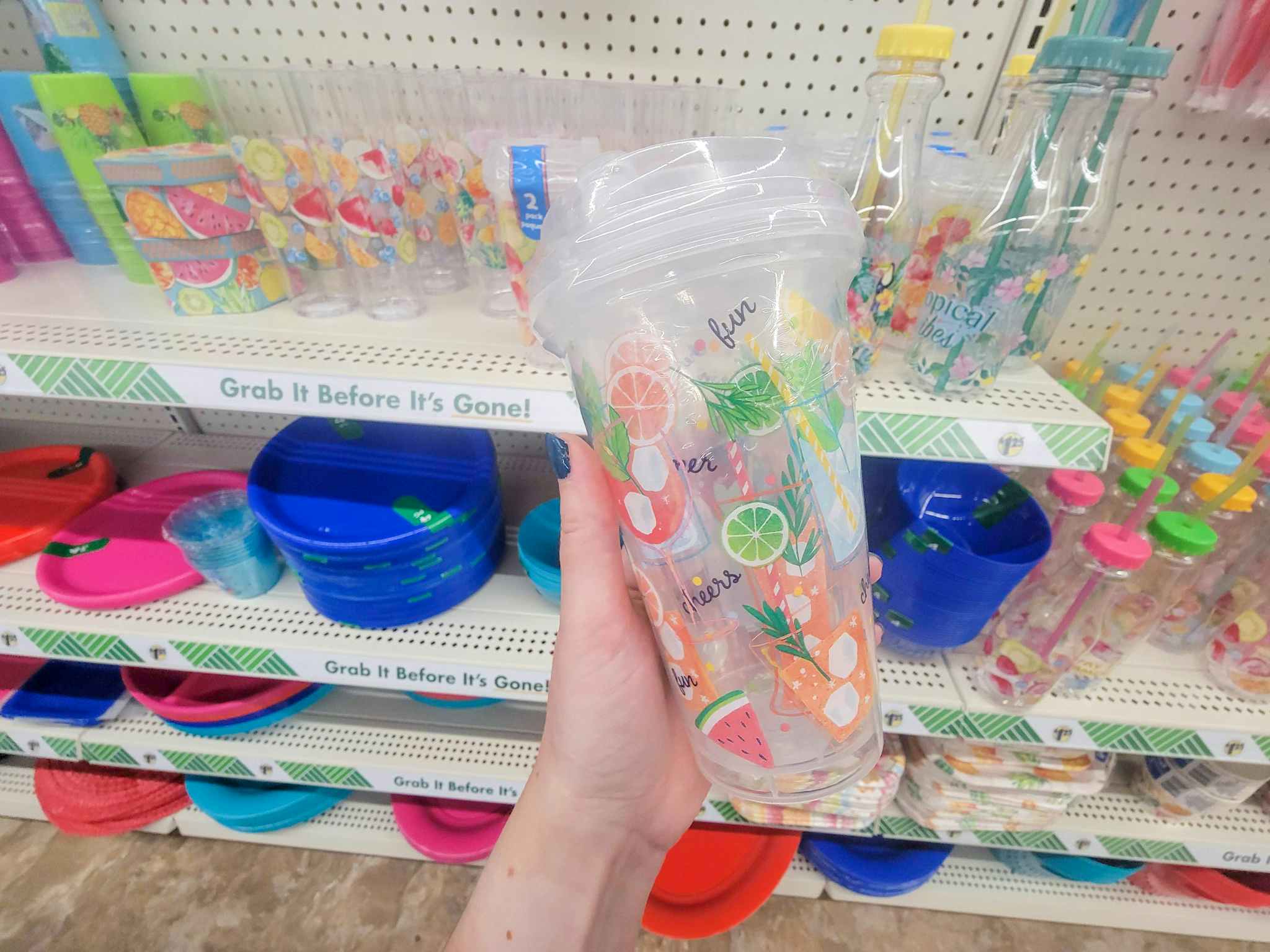 hand holding 2 summer coffee to go cups