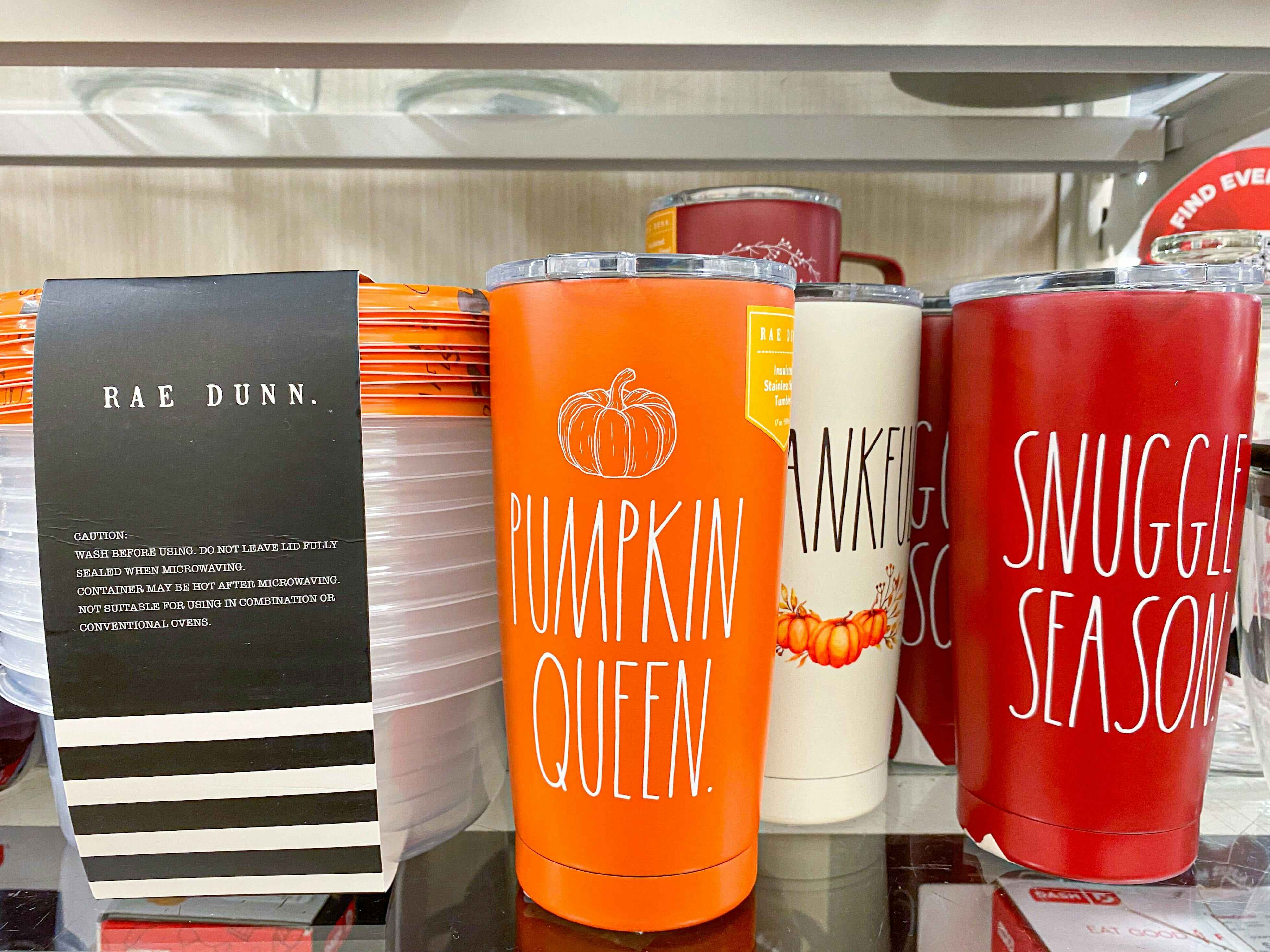 variety of Rae Dunn fall tumblers with sayings on them