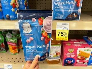 hand holding gerber yogurt melts in front of 75% off tag at CVS
