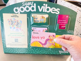 holding a jamba juice gift card