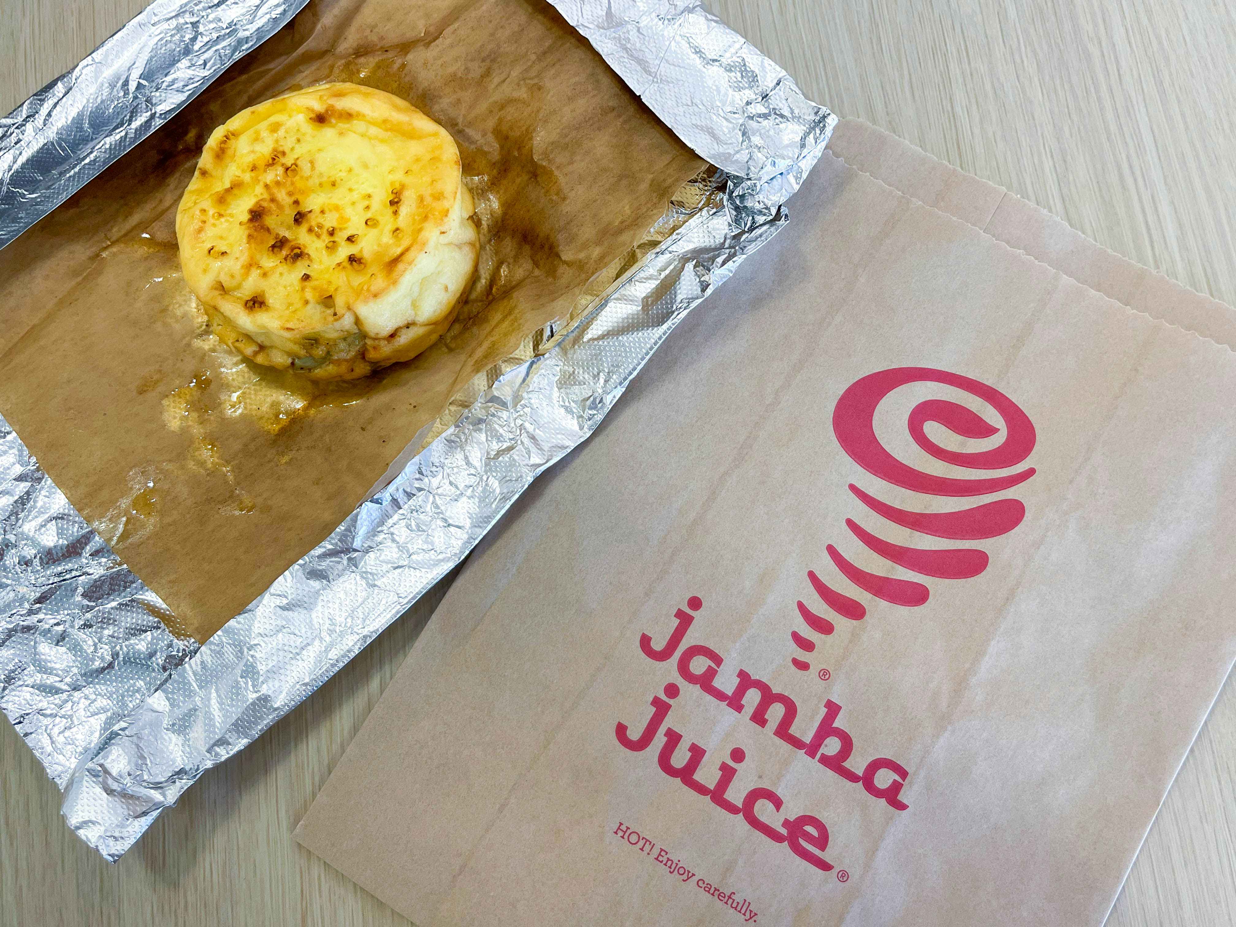 egg bite sitting on table near jamba juice packaging 