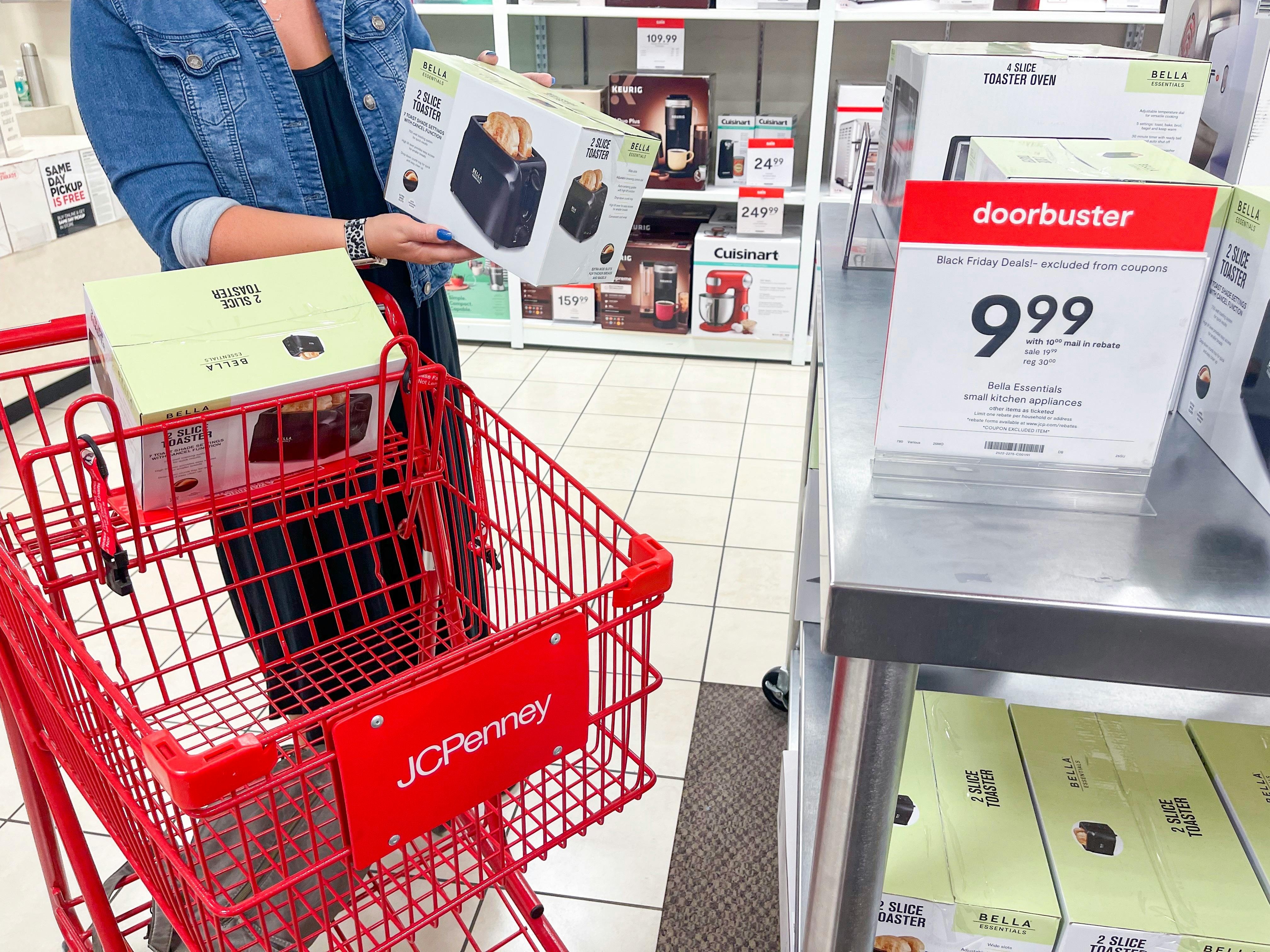 a person putting a toaster in jcpenney cart