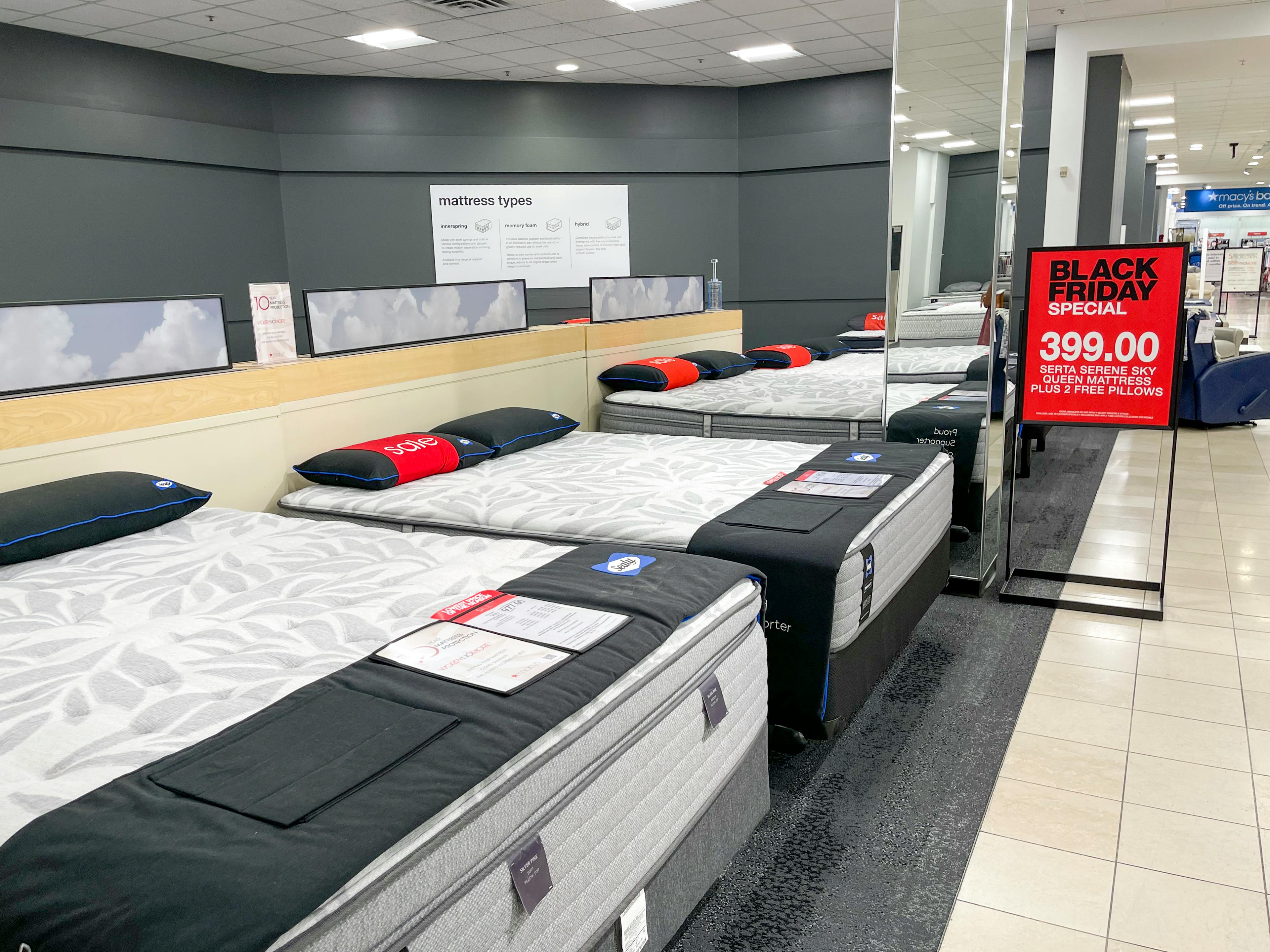 Mattresses on display in a Macy's store.