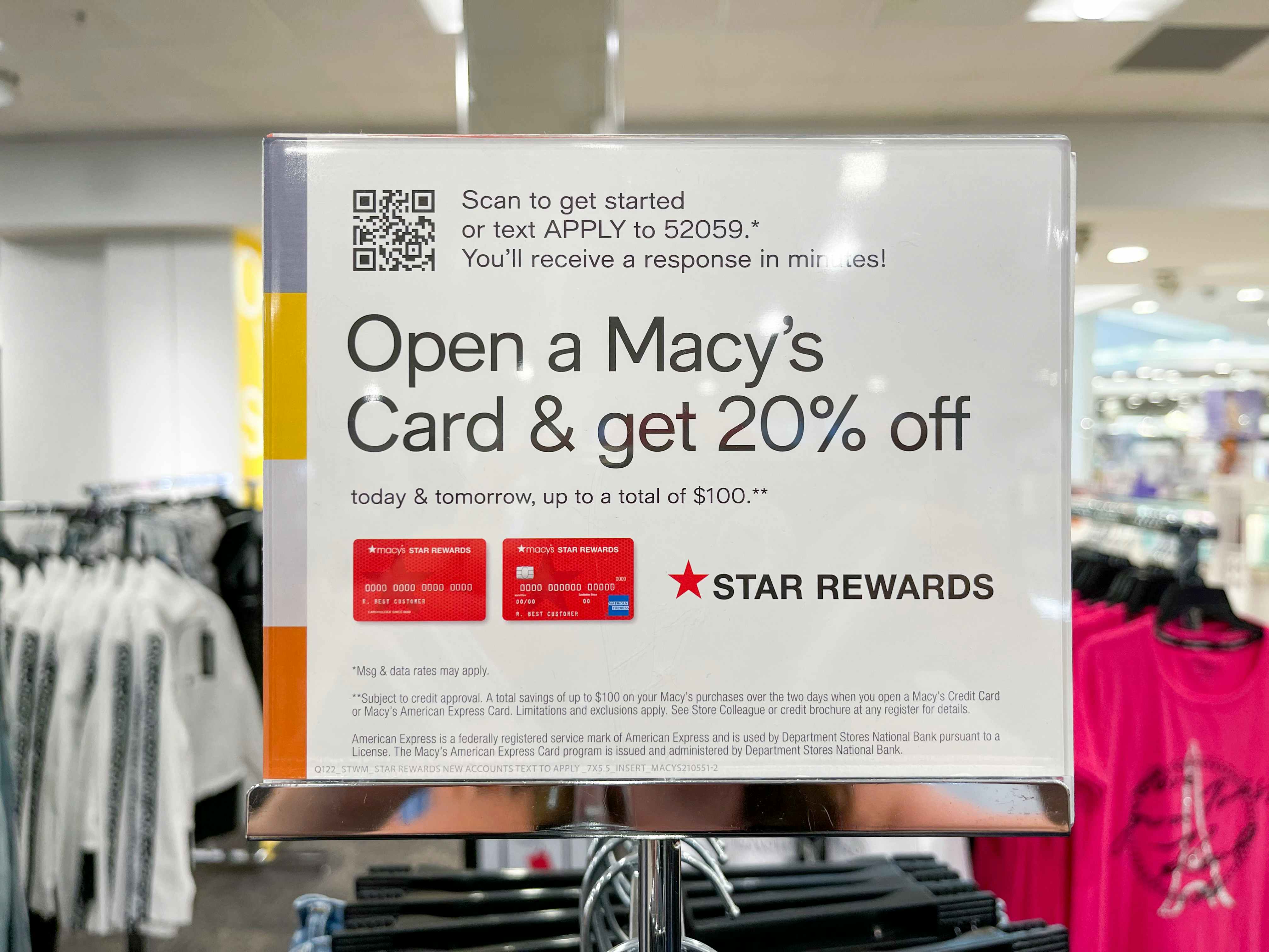 a sign at a Macy's store promoting 20% off when you sign up for a Macy's Credit Card