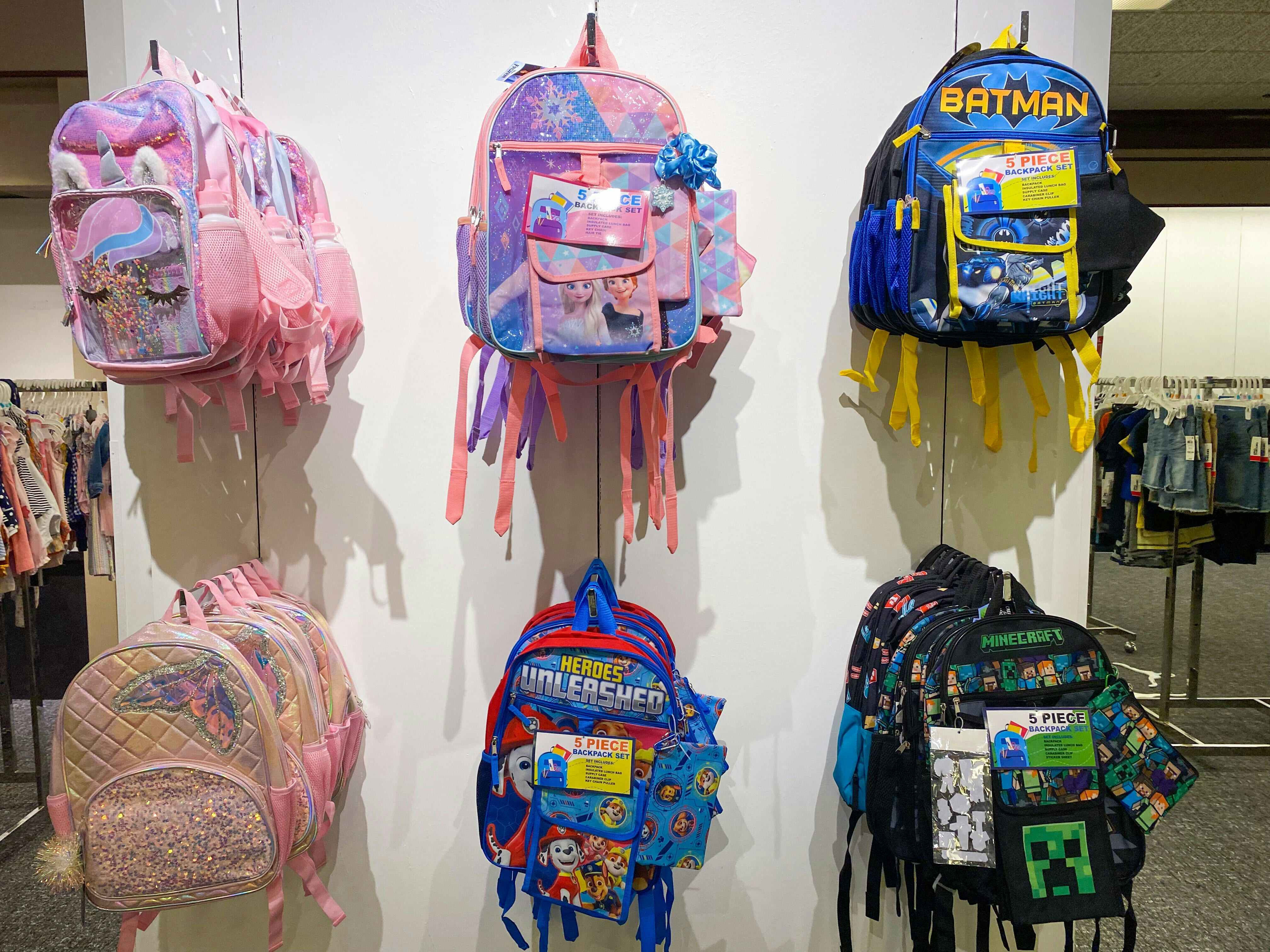 five piece backpack sets on wall