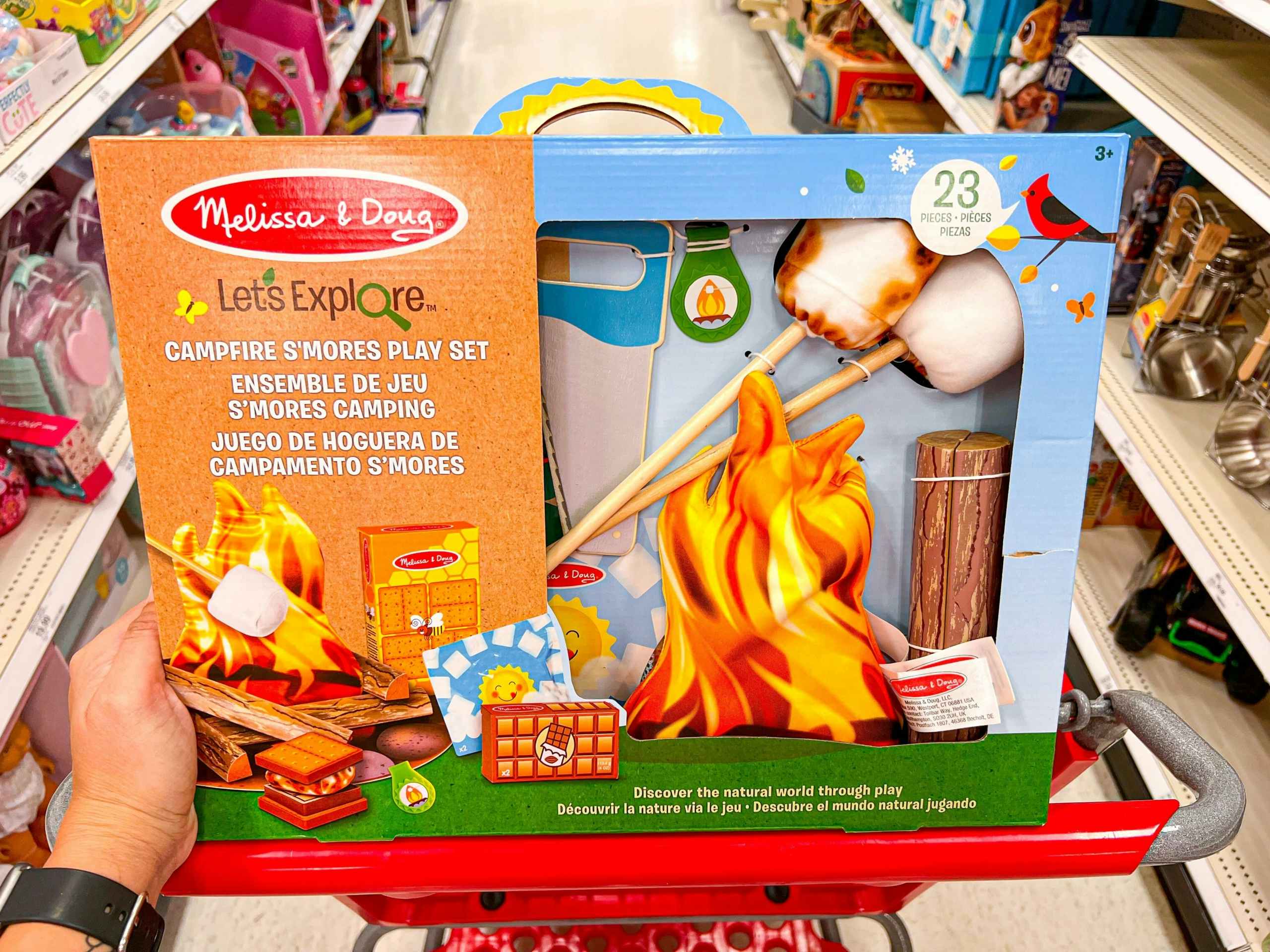 A Melissa & Doug Let's Explore Campfire Smores Play Set in a Target shopping cart